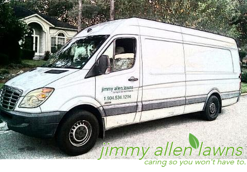 Jimmy’s white work van lettered jimmy allen lawns with 1.904.534.1214 on the door